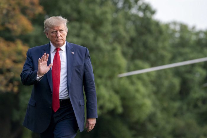 President Donald J. Trump disembarks Marine One on the South Lawn of the White House, Aug. 21, 2019. 