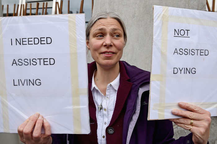 Campaigners against assisted suicide in Scotland hold a rally outside Holyrood, Edinburgh, Scotland, on May 27, 2015. 