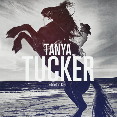 Album cover for 'While I'm Livin'' by Tanya Tucker. Produced by Brandi Carlile and Shooter Jennings. 