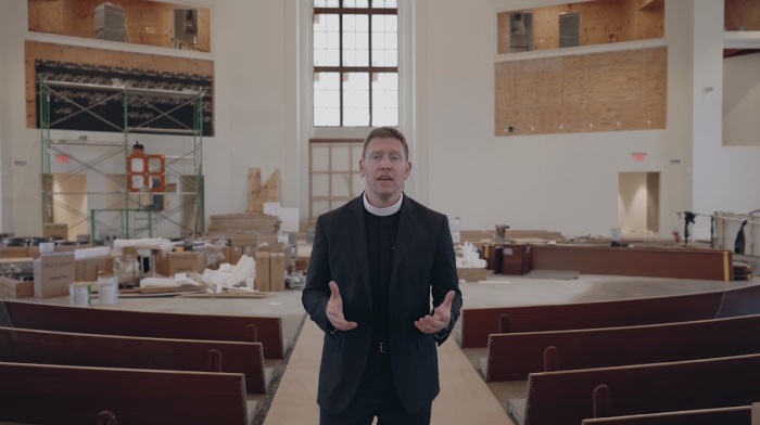 The Reverend Sam Ferguson, rector of The Falls Church Anglican of Falls Church, Virginia, announcing the first worship service at their new property in a video posted August 2019. 