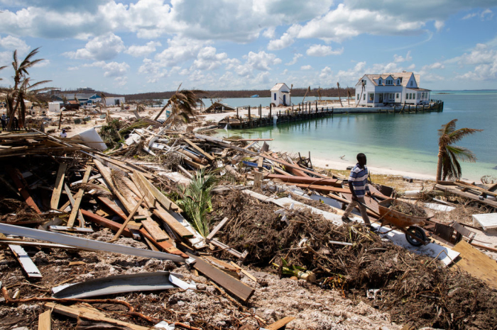 Workers clean debris at the Abaco Inn in Hurricane Dorian devastated Elbow Key Island on Sept. 7, 2019, in Elbow Key Island, Bahamas. The official death toll has risen to 43 and according to officials is likely to increase even more. 