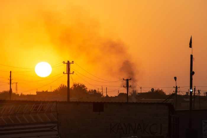 Smoke billows from a village on the Syrian side of the border on Oct. 9, 2019, in Akcakale, Turkey. The military action is part of a campaign to extend Turkish control of more of northern Syria, a large swath of which is currently held by Syrian Kurds, whom Turkey regards as a threat.