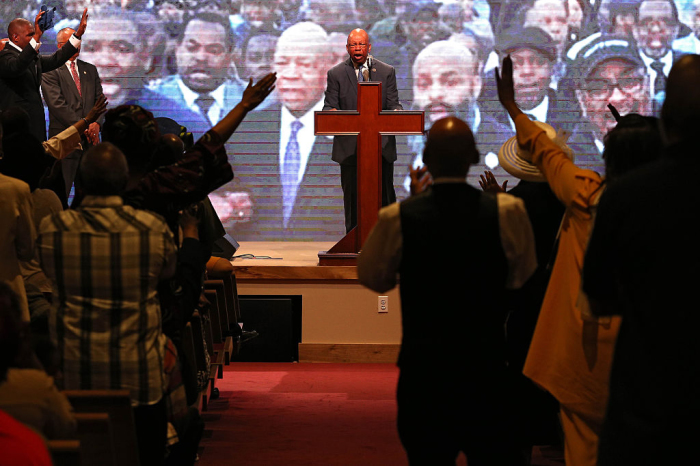 Rep. Elijah Cummings, D-Md., speaks at the Southern Baptist Church with pastor Donte L. Hickman Sr., (not pictured) two days after Baltimore authorities released a report on the death of Freddie Gray on May 3, 2015, in Baltimore, Maryland. 