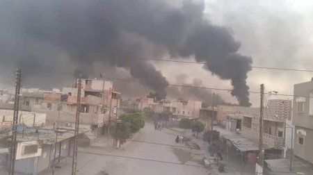 Smoke rises during the Turkish October 2019 military campaign in northeastern Syria.