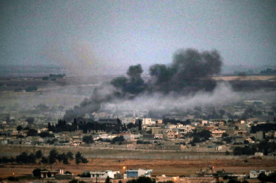 Smoke rises over the Syrian town of Ras al-Ain on October 17, 2019 as seen from the Turkish border town Ceylanpinar, Turkey. The military action is part of a campaign to extend Turkish control of more of northern Syria, a large swath of which is currently held by Syrian Kurds, whom Turkey regards as a threat. 