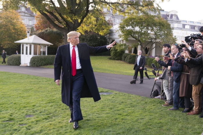 President Donald J. Trump waves after talking with reporters on the South Lawn of the White House Monday, Nov. 4, 2019, and walks to board Marine One to begin his trip to Kentucky.