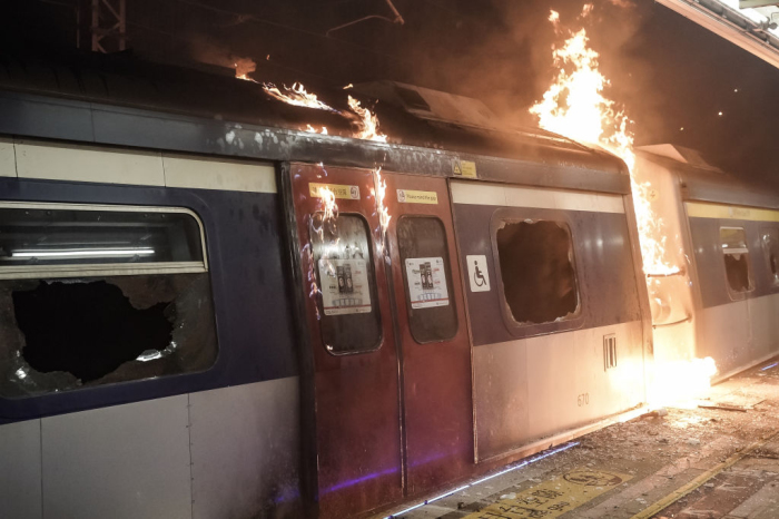 A train car burns at a MTR station during a demonstration at Chinese University of Hong Kong on November 13, 2019, in Hong Kong, China. 