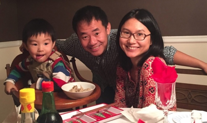 Princeton University graduate student Xiyue Wang poses for a picture with his wife and son.