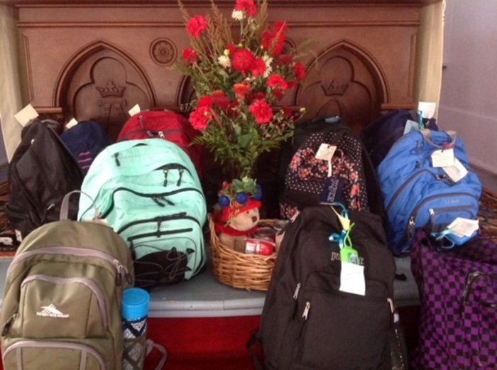 Backpacks with supplies for women who have just left prison are gathered by a ministry at St. John's Episcopal Church of Ashfield, Massachusetts. 