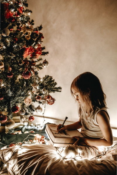 Girl writing to Santa.