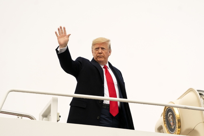 President Donald J. Trump waves as he boards Air Force One Saturday, Dec. 14 2019, at Joint Base Andrews, Md. for his flight to Philadelphia, Pa., to attend the 120th Army-Navy football game.