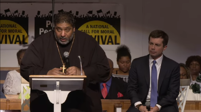 Social justice advocate and pastor of Greenleaf Christian Church in Goldsboro, NC, William Barber II (podium), for hosts gay Democratic presidential candidate, Mayor Pete Buttigieg (R).