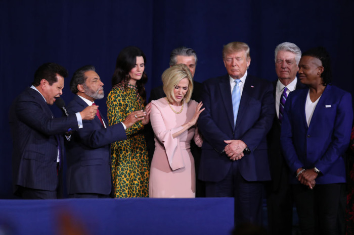 Faith leaders pray over President Donald Trump during a 'Evangelicals for Trump' campaign event held at the King Jesus International Ministry on January 3, 2020, in Miami, Florida. 