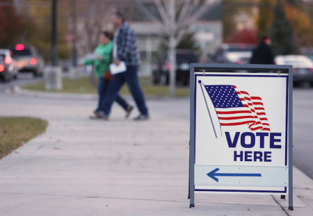 A couple walks into a polling center to vote in the midterm elections on November 6, 2018, in Provo, Utah.