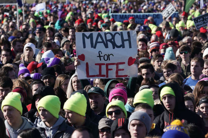 Pro-life activists participate in a rally at the National Mall prior to the 2018 March for Life January 19, 2018, in Washington, D.C. Activists gathered in the nation's capital for the annual event to protest the anniversary of the Supreme Court Roe v. Wade ruling that legalized abortion in 1973. (Photo by Alex Wong/Getty Images)