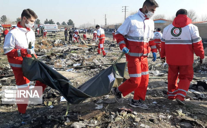 Emergency workers at the crash site of Ukraine International Airlines flight PS752 in Tehran, Iran, on Jan. 8, 2020.