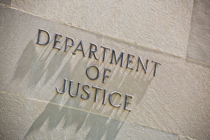 The entrance signage for the United States Department of Justice Building in Washington D.C. The Department of Justice, the U.S. law enforcement and administration of Justice government agency.