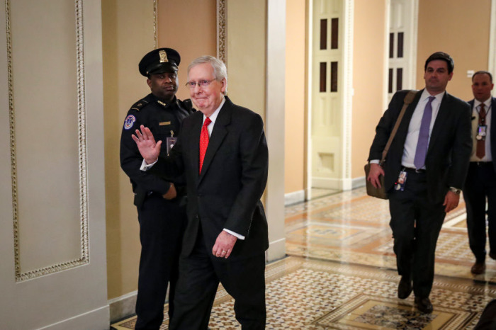 At nearly 2 a.o'clockm., Senate Majority Leader Mitch McConnell, R-Ky., leaves for the night after the Senate adjourned for the night during the impeachment trial proceedings at the U.S. Capitol on January 22, 2020, in Washington, D.C. The Senate impeachment trial of U.S. President Donald Trump will resume on Wednesday at 1 p.m. 