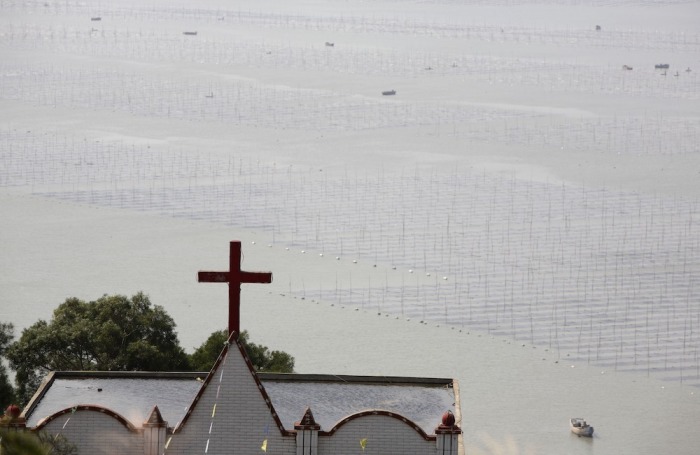 A church is seen beside a laver farm at the Gutong Village of Sansha Township on October 15, 2007, in Xiapu County of Fujian Province, China.