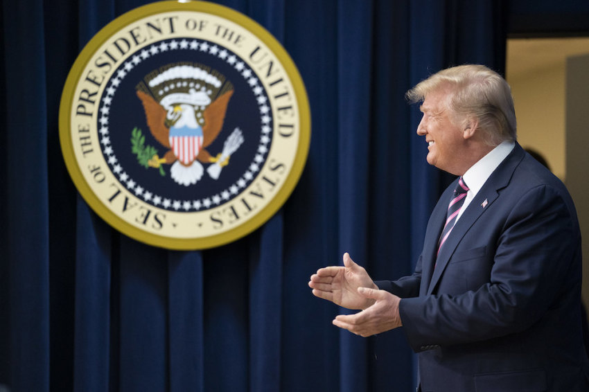 President Donald J. Trump applauds the crowd as he is introduced on stage at the Summit on Transforming Mental Health Treatment on Thursday, Dec. 19, 2019, at the Eisenhower Executive Office Building South Court Auditorium at the White House.