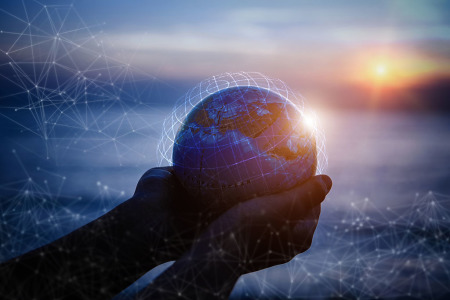 Hands holding the globe.