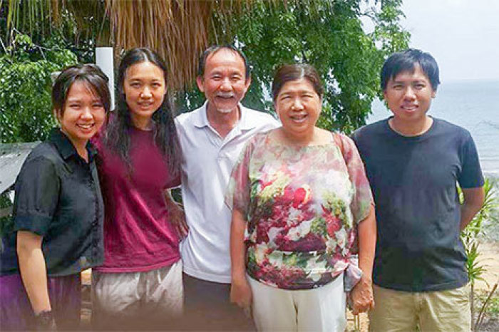 Raymond Koh (center) with his family