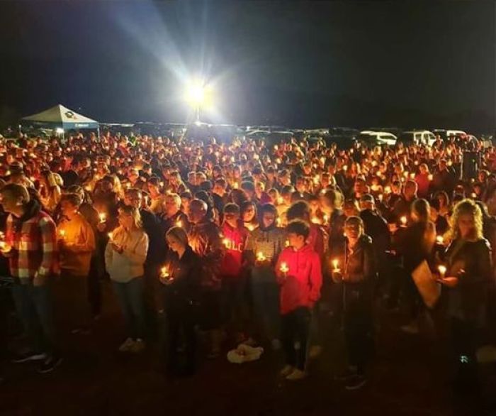 People attend a candlelight vigil on Jan. 25, 2020, in Corona, California, to remember Daniel Hawkins, Jacob Ivascu and Drake Ruiz, three teens who were killed in a car crash.