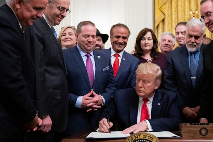 President Donald J. Trump signs H.R. 2476 the Securing American Nonprofit Organizations Against Terrorism Act of 2019, following his remarks at the Nation’s Mayors on Transforming America’s Communities meeting Friday, Jan. 24, 2020, in the East Room of the White House. 