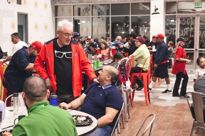 Los Angeles Angels Manager Joe Maddon socializes at a 'Thanksmas' event put on by his Respect 90 Foundation at the Orange County Rescue Mission's Village of Hope in Tustin, California, on Jan. 28, 2020.