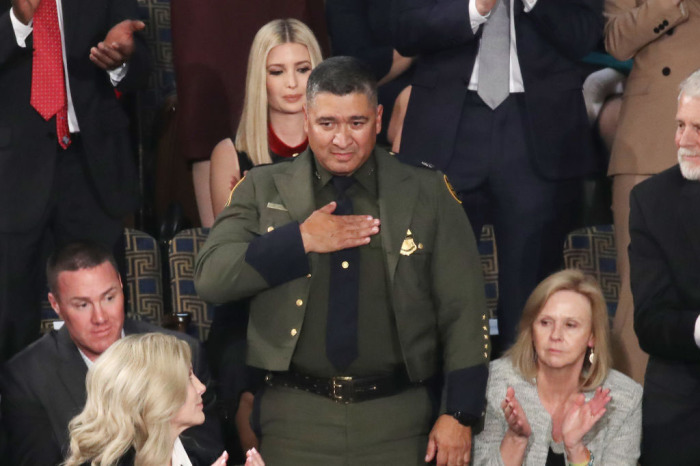 Deputy Chief of U.S. Border Patrol Raul Ortiz (C) acknowledges applause at the State of the Union address in the chamber of the U.S. House of Representatives on February 04, 2020, in Washington, D.C. 