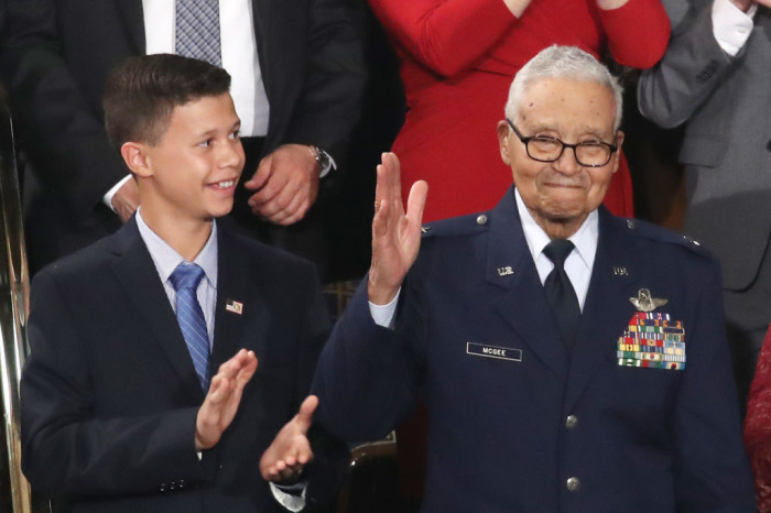 Retired U.S. Air Force Col. Charles McGee, who served with the Tuskegee Airmen, attends the State of the Union address with his great-grandson Iain Lanphier in the chamber of the U.S. House of Representatives on February 04, 2020, in Washington, D.C. 