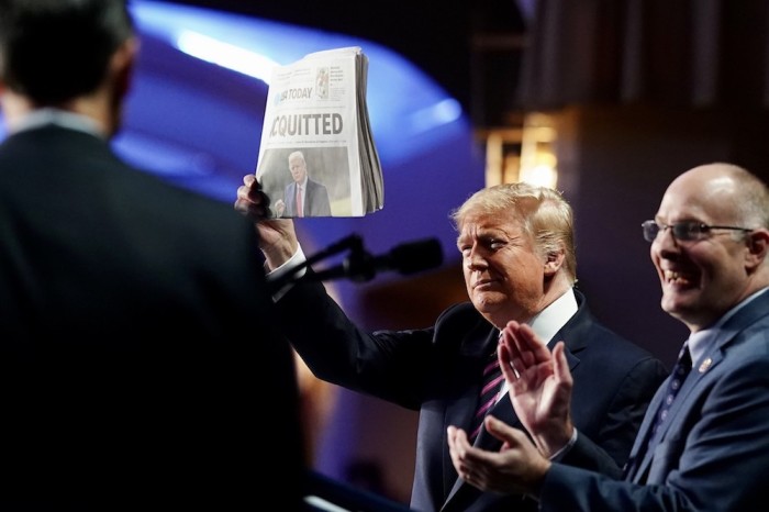 President Donald J. Trump holds up a copy of USA Today during the 2020 National Prayer Breakfast Thursday, Feb. 6, 2020, at the Washington Hilton in Washington, D.C. 