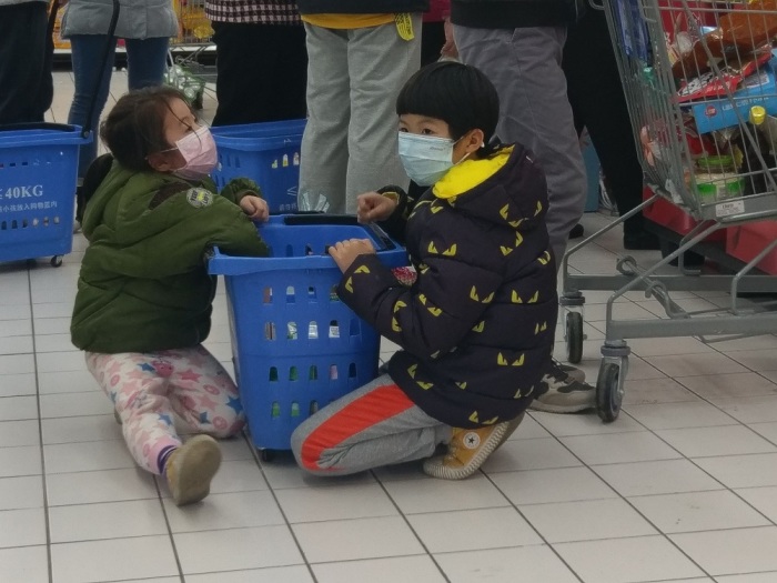 Two children wear facemasks in China during the 2019-2020 coronavirus outbreak. 