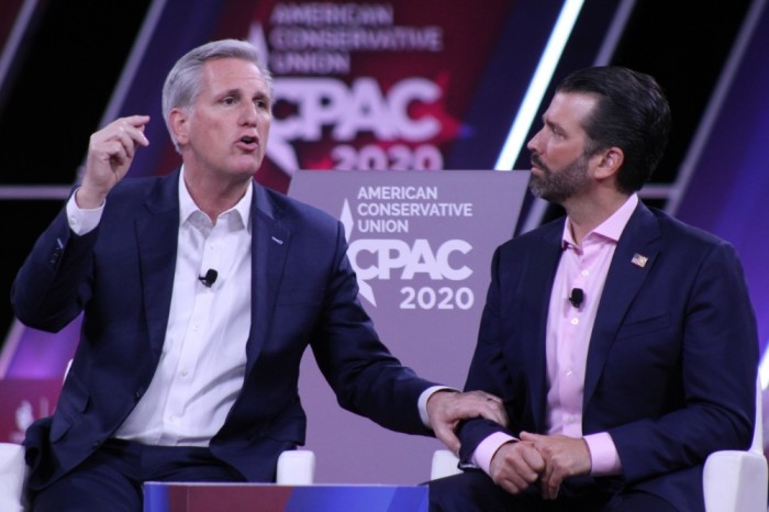 House Minority Leader Kevin McCarthy, R-Calif., (L) speaks at the 2020 Conservative Political Action Conference in Oxon Hill, Maryland, on Feb. 28, 2020. To his left is Donald Trump Jr. 
