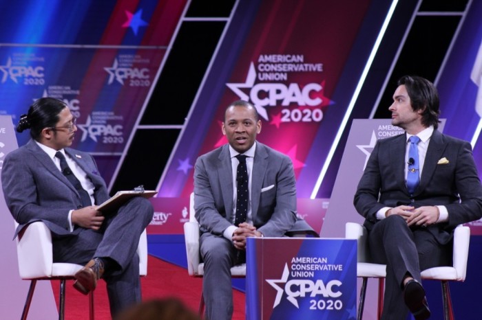 BlazeTV's Jon Miller speaks during the 2020 Conservative Political Action Conference in Oxon Hill, Maryland on Feb. 28, 2020. He is flanked by WalkAway Campaign's Brandon Straka (R) and American Conservative Union Communications Director Ian Walters. 