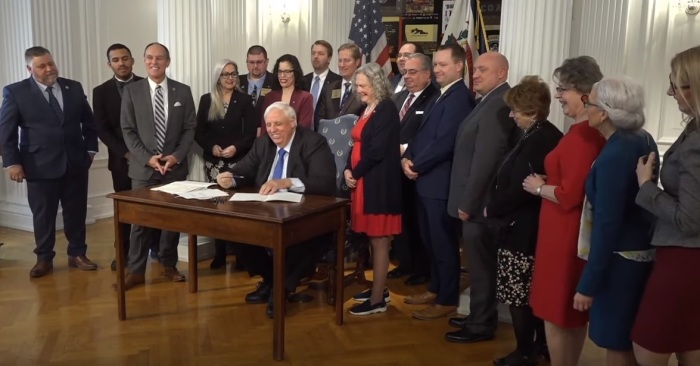 West Virginia Governor Jim Justice signs the House Bill 4007, also called The Born-Alive Abortion Survivors Protection Act, at the State Capitol in Charleston on Monday, March 2, 2020.