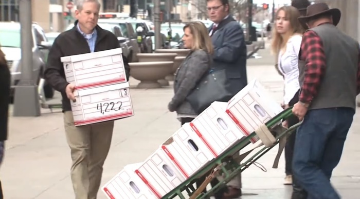 Pro-life activists deliver around 138,000 signatures to the Colorado Secretary of State's office on Wednesday, March 4, 2020 in support of a ballot initiative to ban late term abortions in most circumstances. 
