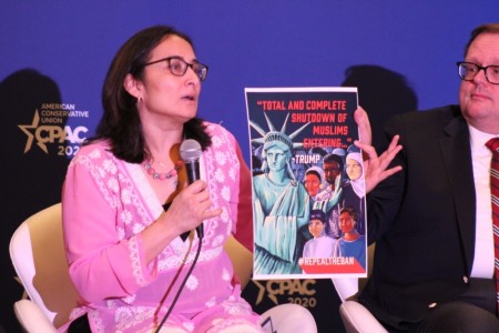 Muslim reformer Asra Nomani holds up a poster as she explains how some Islamist groups are using domestic political issues in the United States to instill a fear of Islamophobia. Nomani spoke as a panelist at the 2020 Conservative Political Action Conference in Oxon Hill, Maryland, on Feb. 27, 2020.