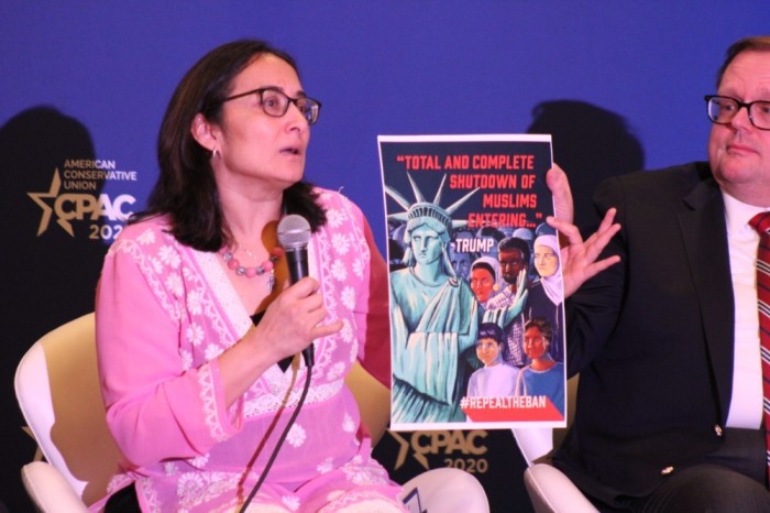 Muslim reformer Asra Nomani holds up a poster as she explains how some Islamist groups are using domestic political issues in the United States to instill a fear of Islamophobia. Nomani spoke as a panelist at the 2020 Conservative Political Action Conference in Oxon Hill, Maryland, on Feb. 27, 2020. 