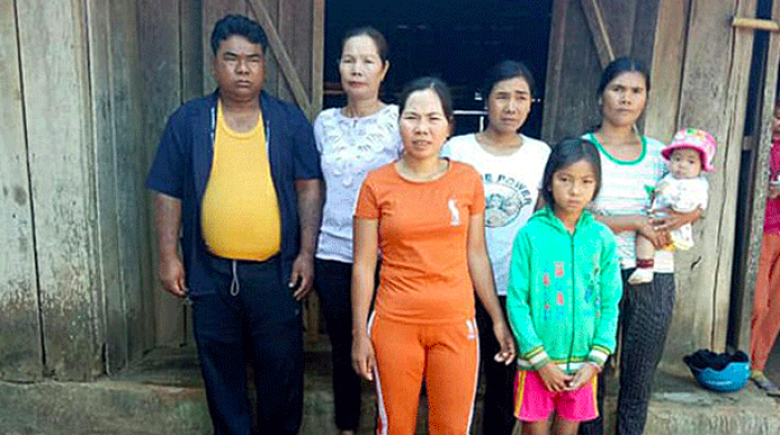 Y Ngun Knul (L) is shown with his wife and children after his release from prison in an undated photo. 