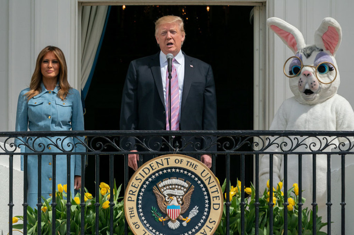 President Donald J. Trump, joined by First Lady Melania Trump, delivers remarks on the Blue Room balcony of the White House as they welcome guests Monday, April 22, 2019, to the 141st White House Easter Egg Roll. 
