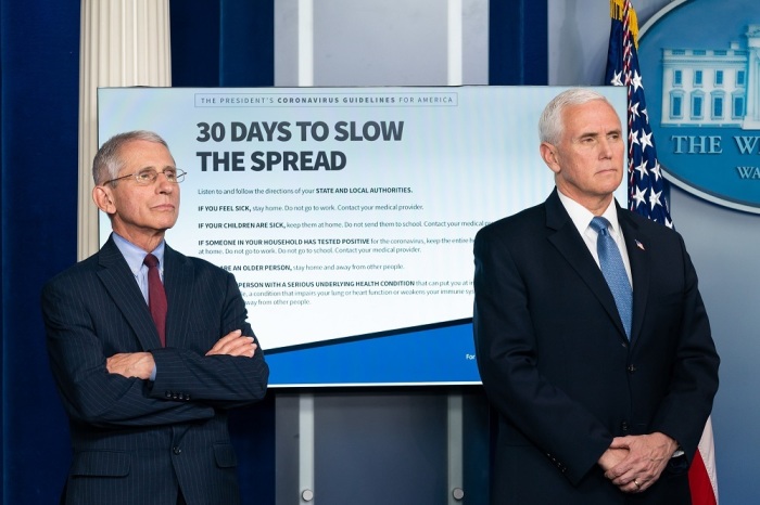 Dr. Anthony S. Fauci (L), director of the National Institute of Allergy and Infectious Diseases and Vice President Mike Pence (R).