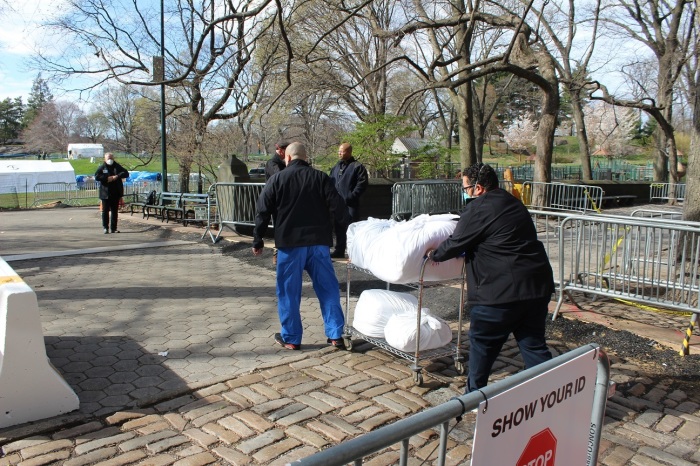 Workers transport supplies from Mount Sinai Hospital to the Samaritan's Purse field hospital on the East Meadow of New York CIty's Central Park on Thursday, April 2, 2020.