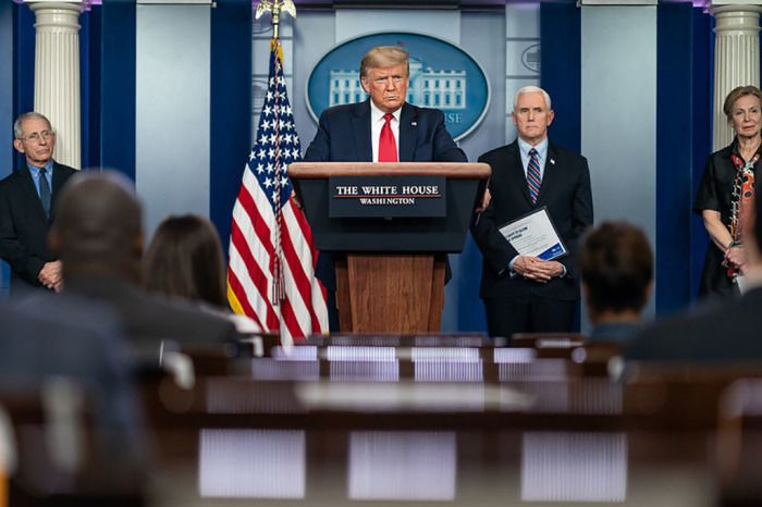 President Donald J. Trump, joined by Vice President Mike Pence and members of the White House Coronavirus Task Force, listens to a reporter’s question at a coronavirus (COVID-19) update briefing Thursday, March 26, 2020, in the James S. Brady Press Briefing Room of the White House. 