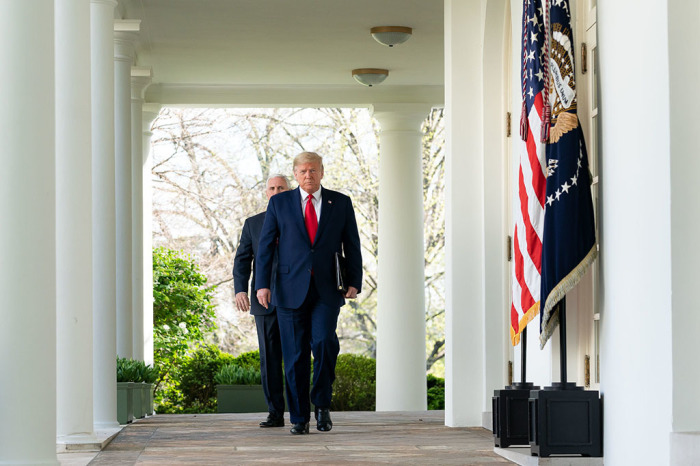 President Donald J. Trump and Vice President Mike Pence walk along the Colonnade of the White House prior to a coronavirus (COVID-19) update briefing Monday, March 30, 2020, in the Rose Garden at the White House. 