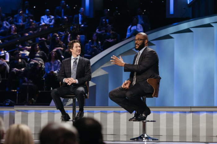 Joel Osteen (L), pastor of Lakewood Church in Houston, Texas, interviews Christian Hollywood film producer Tyler Perry (R) on August 5, 2018.