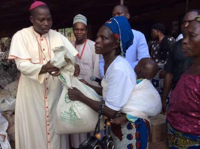The Catholic Bishop of Yola Diocese Stephen Mamza distributes aid to victims of Boko Haram insurgency in Nigeria's Adamawa state.