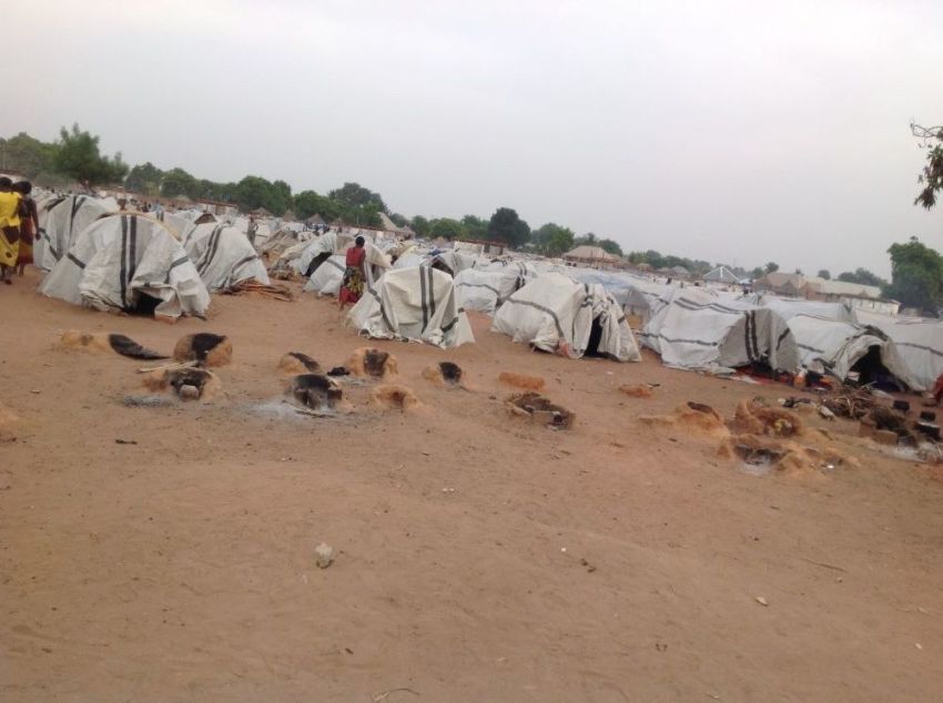 Internally displaced persons walk around a displacement camp in Benue state of Nigeria in October 2018. Since then, the government has constructed better tent structures for the people living at the camp. 