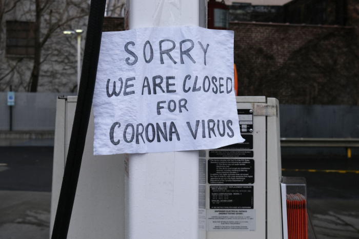 A sign at a gas station alerts customers that a business in Queens, which has one of the highest infection rates of coronavirus in the nation, is closed on April 03, 2020 in New York City. 