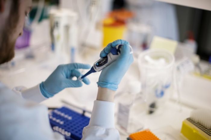A researcher works on a vaccine against the new coronavirus COVID-19 at the Copenhagen's University research lab in Copenhagen, Denmark, on March 23, 2020. 
